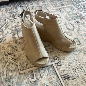 Sand colored sand wedges with peep toe and adjustable heel buckle